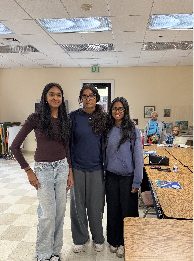 Three CARES officers standing together in the activity room